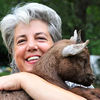 Nance Wolff, owner of Souls 'n Bloom with a baby goat